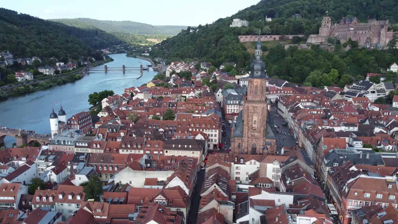 Cinematic 4K drone clip over the church and buildings of the old town of Heidelberg, Germany