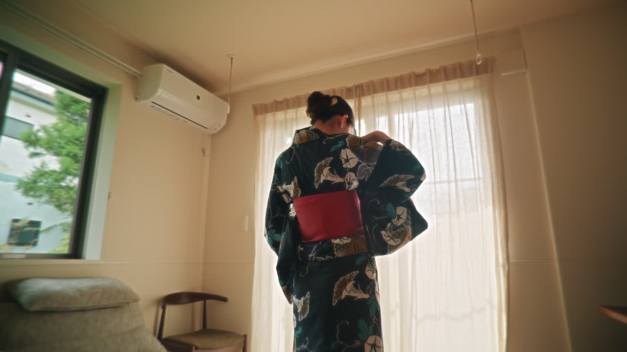 Woman wearing a yukata in a room