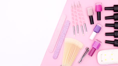 manicure tools moving on pink side of pink white theme. stop motion