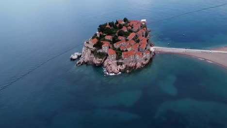 the famous island of sveti stefan located near budva on the coast of montenegro in the balkans