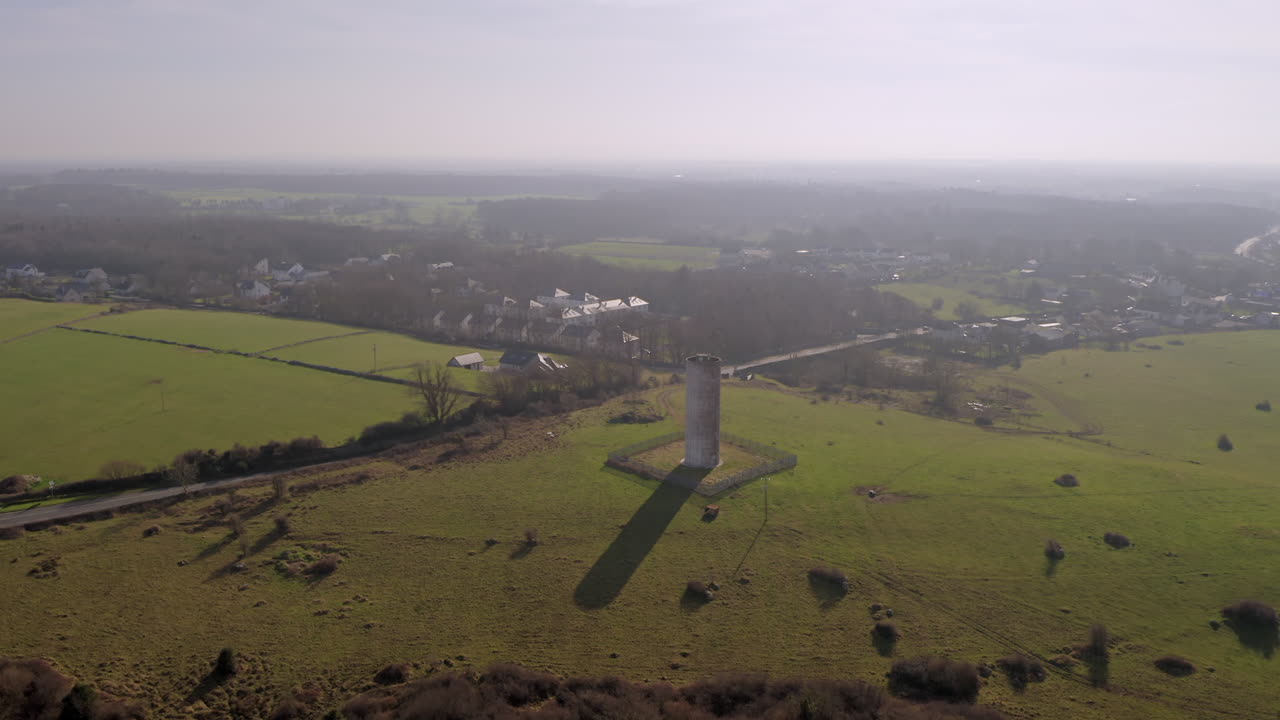 Wide-angle aerial orbit of Clarinbridge water tower on a glorious morning, Galway, Ireland
