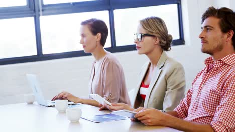 Executives-clapping-hands-in-a-meeting