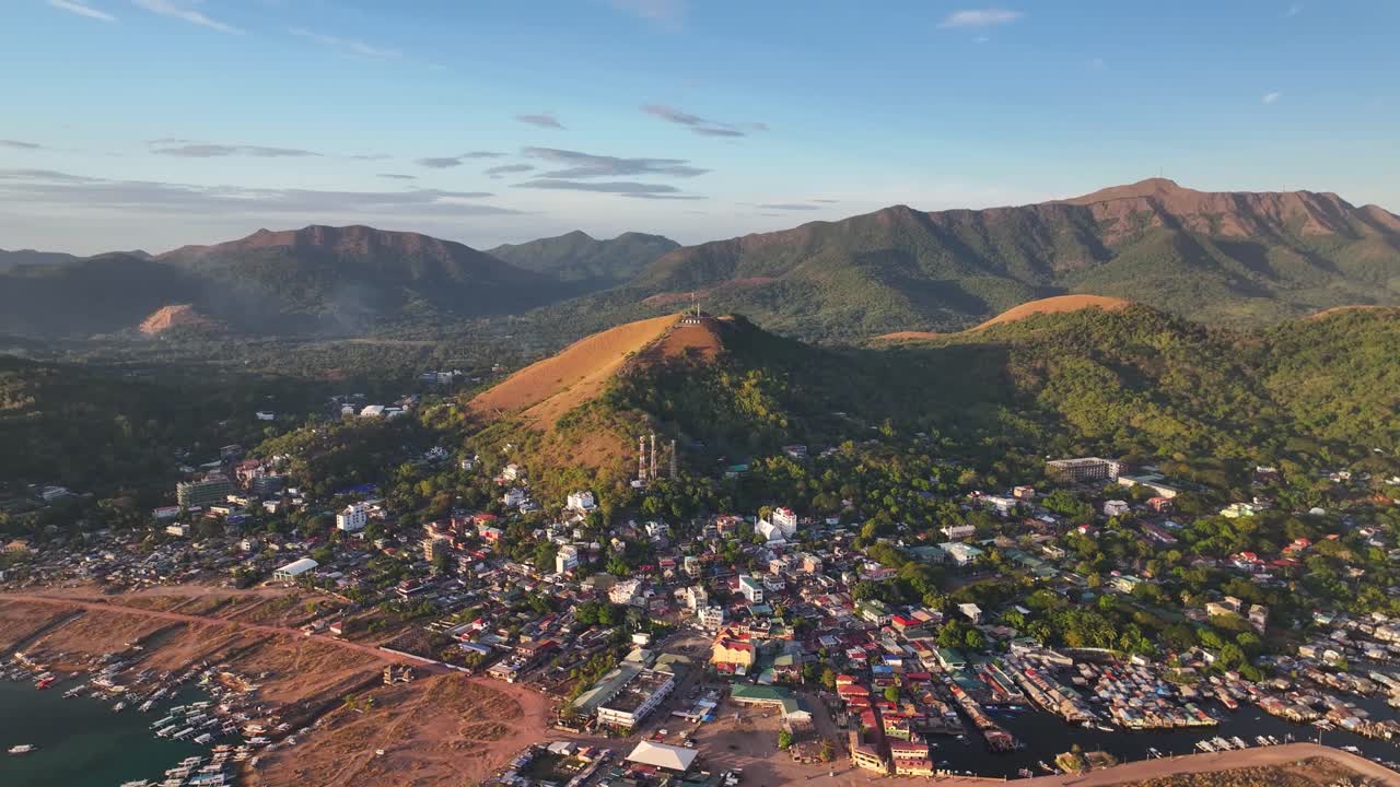 Coron township with street, buildings and port with market. Aerial wide landscape. Philippines.