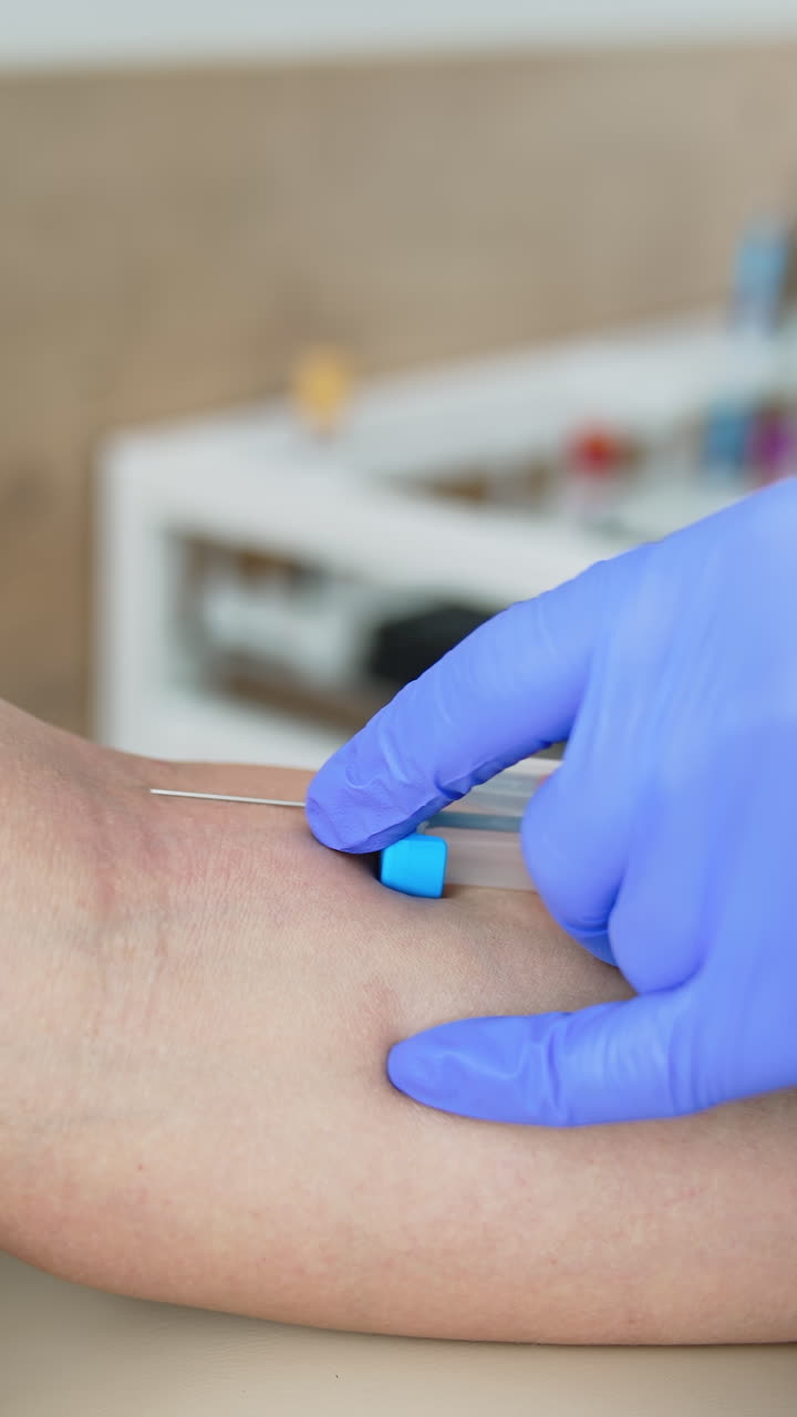 Global vaccination campaign. Woman getting intravenous meds injection at clinic. Professional medicare concept. Epidemic diseases prevention. Close-up. Vertical video