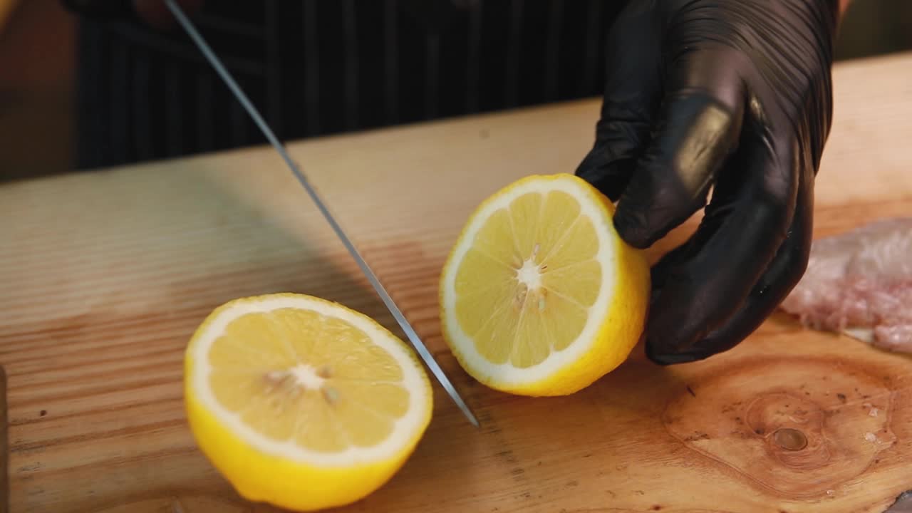 Chef preparing lemon and fish