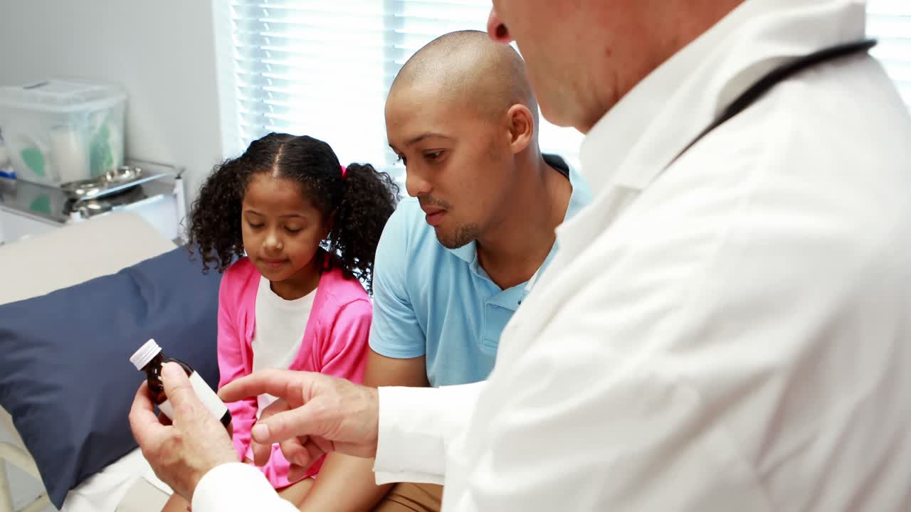 Male doctor prescribing medicine to patient