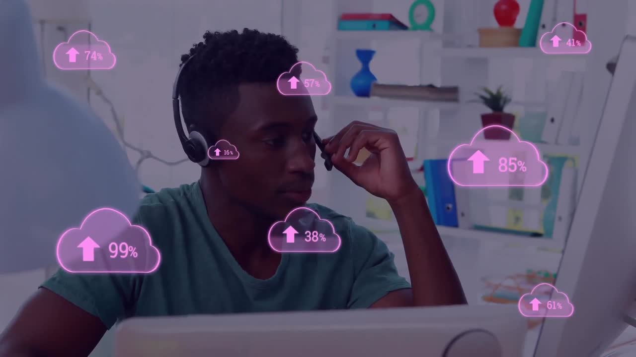 Animation of cloud icons flying over a man using phone headset at home