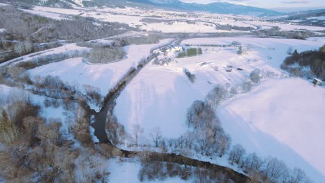 aerial view of sunny winter snow landscape in tatra national park slovakia, fresh white snow ski resort town