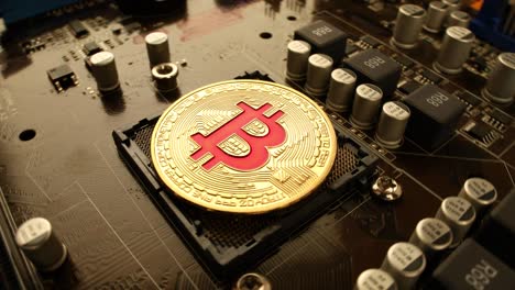 gold bit coin btc coins on the motherboard. bitcoin is a worldwide cryptocurrency and digital payment system called the first decentralized digital currency.