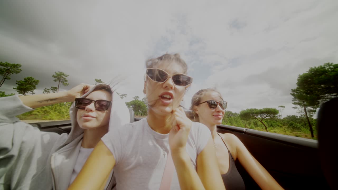 Three women on a road trip in a convertible