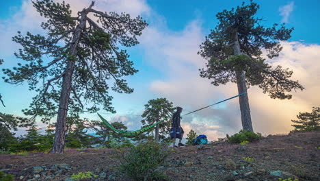 timelapse of hiker taking down hammock camping set up on mount olympos cyprus