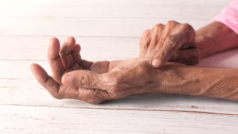 elderly person checking pulse