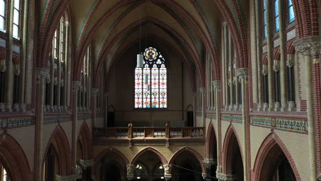 interior of gouwekerk , a gothic revival cruciform church in dutch city of gouda in the netherlands