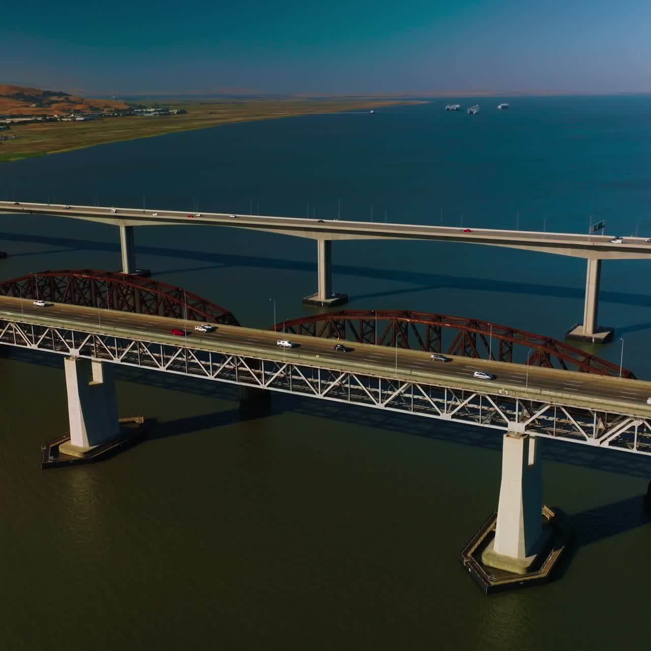 Splendid view of marine scenery with bridges at foreground. Martinez to Benicia roads on the beautiful bridges over the strait