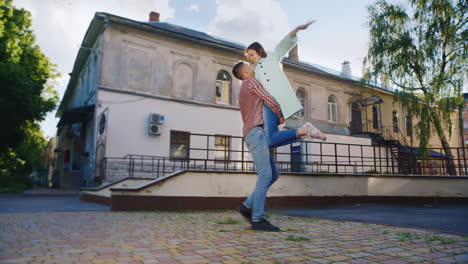 loving couple embracing in the sun against the background of an old building hd video