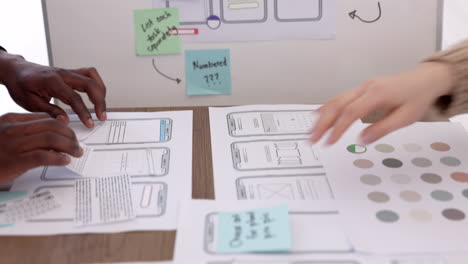 phone, app and teamwork with a designer team