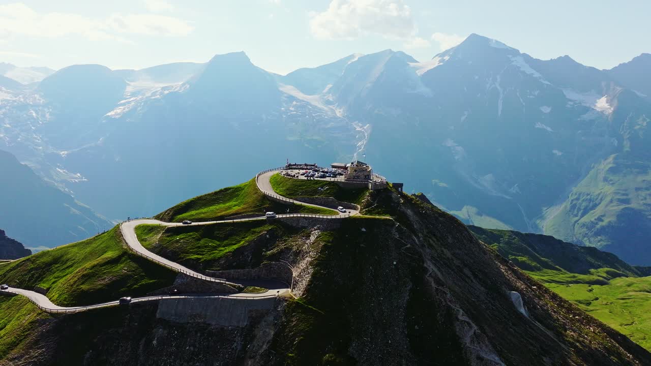 Cars ascend the highest point of Grossglockner High Alpine Road in slow motion