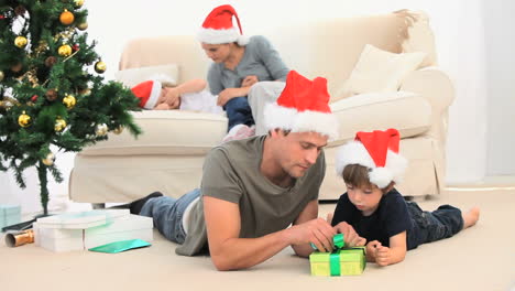father opening a gift from his son