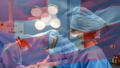 Animation-of-flag-of-switzerland-waving-over-surgeons-in-operating-theatre