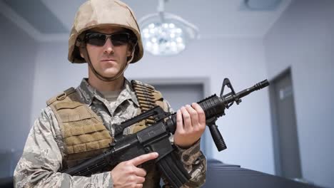 Animation-of-caucasian-male-soldier-with-weapon-over-surgery