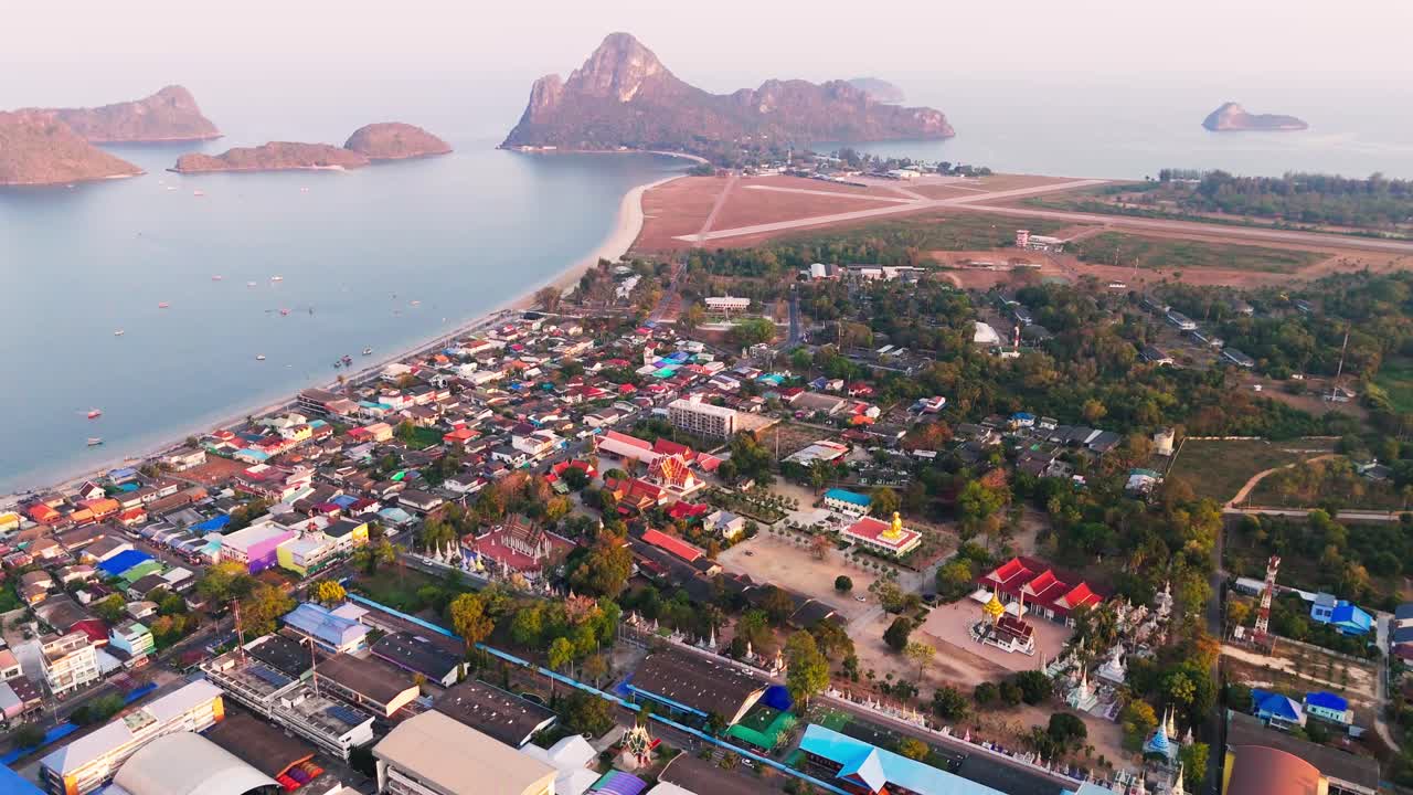 Discover the stunning coastline of Prachuap Khiri Khan, where a vibrant city meets the ocean. The hills rise beautifully from the water, offering a breathtaking view that showcases nature's harmony.