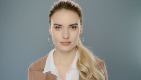 Business-woman-showing-thumbs-down-in-studio