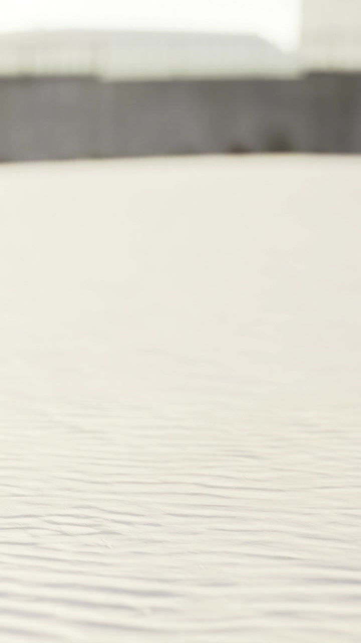 Waves on a quiet surface at a coastal location during late afternoon