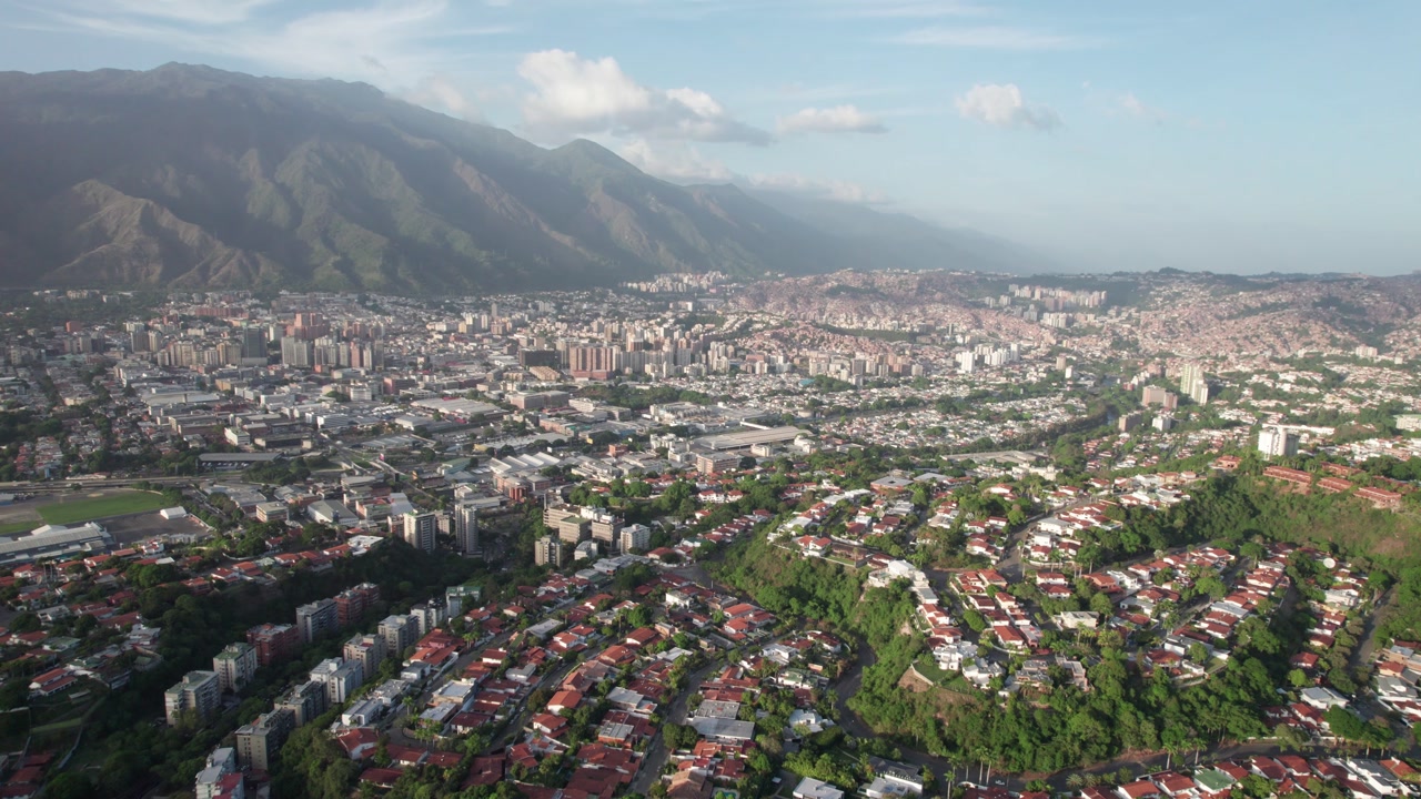 Tilt up zenith drone revealing layout of Macaracuay, Caracas, with street grid