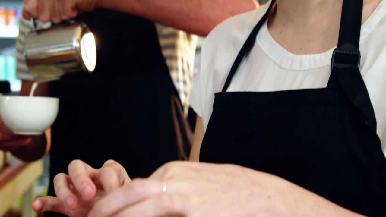 Waitress wrapping sandwich with a wax paper