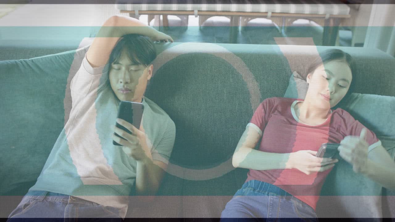 Man entering and woman reclining on sofa, using phones, relaxing, tech scan lines overlaying scene