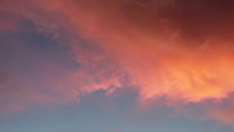 sunset- sunrise colors reflected in puffy clouds