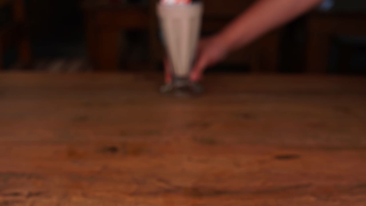 Detailed close up of chocolate milkshake, with caramel, espresso and whipped cream, tilt up and down
