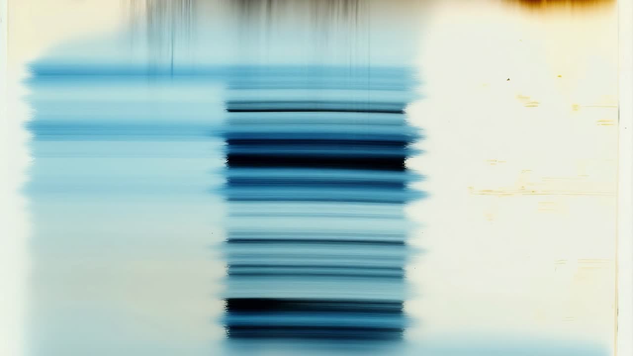 Abstract video art with a blurred blue gradient, shot from a straight-on angle, creating a dreamy