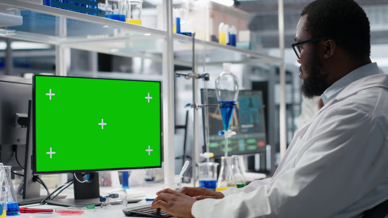 Lab Worker Using Isolated Screen Computer For Dna Data Analysis