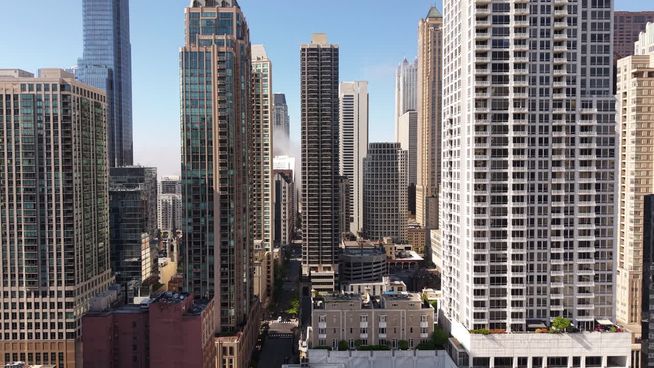 Drone Shot of Downtown Chicago USA With Rising Fog From Lake Michigan on Sunny Day
