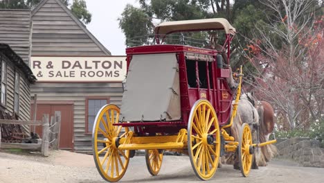 carriage moving through historic town setting
