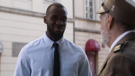 Two-men-talking-on-the-street