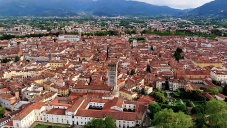 Beautiful-aerial-shot-of-Lucca-city,-an-ancient-town-in-the-middle-of-Tuscany,-Italy,-4K