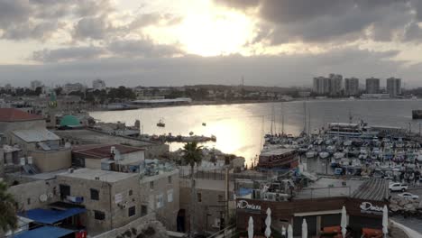 sunset over the old port cityscape