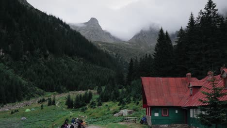 Tilt-up-camera-movement-showing-a-hut-and-a-valley-in-the-Fagaras-Carpathian-Mountains