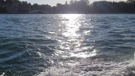 venice from a boat sailing sunlight on water splashes 30 frames per sec 6 sec