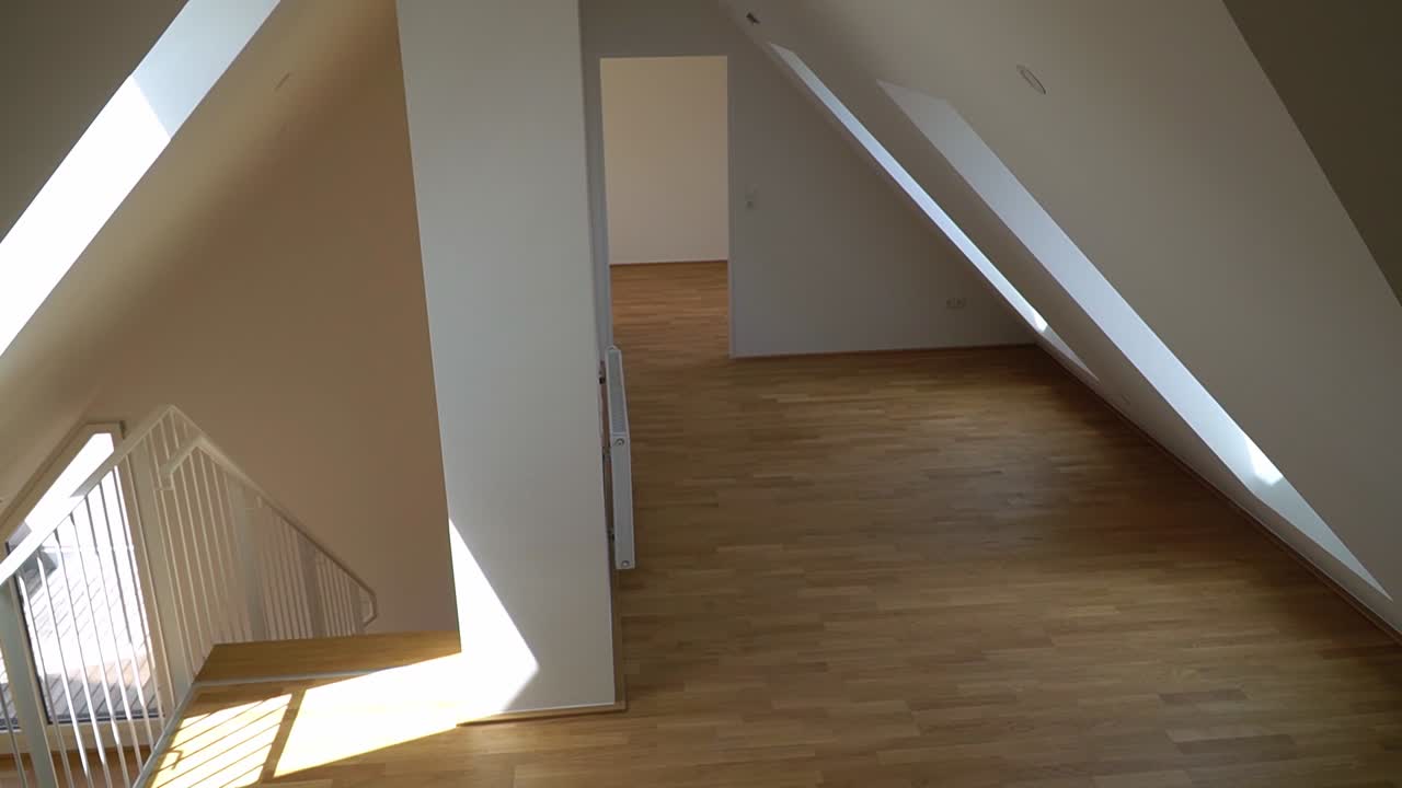 Attic apartment with many rooms. Empty living space for sale.