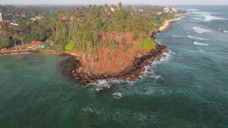 coconut tree hill, mirissa, sri lanka. drone aerial view of popular touristic spot on indian ocean coast