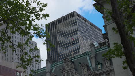 Looking-Up-At-Large-Square-Office-Building-In-New-York