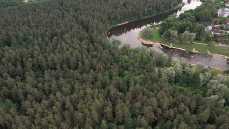 An-aerial-view-of-Valmiera-city,-showcasing-its-blend-of-urban-and-natural-elements