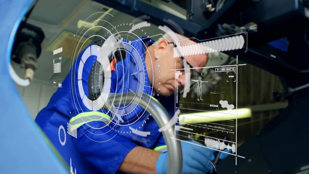 Maintenance tech crouching under machinery scanning hoses with flashlight revealing overlays