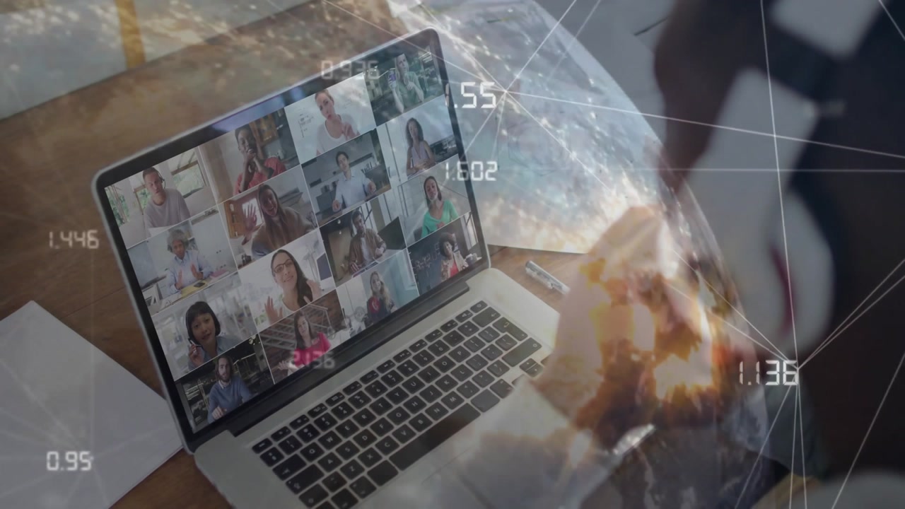 Business user pausing typing to write notes calling team in meeting while globe and data flickering