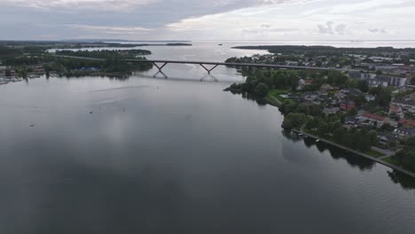 huge bridge bro connects the city motala in sweden, aerial pan right, cloudy day