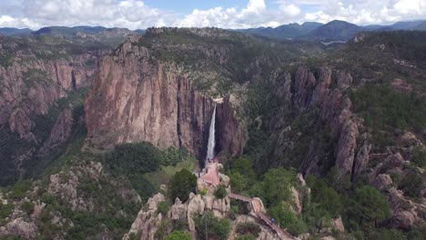 aerial jib up shot revealing the basaseachi waterfall behind a scenic lookout, in the candamena canyon, chihuahua