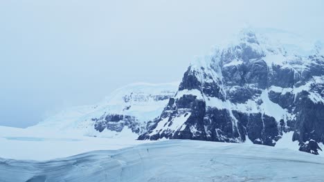 antarctica blue winter mountains scenery with glacier, beautiful dramatic antarctica landscape with cold ice scene, close up detail of geography of ice on antarctic peninsula
